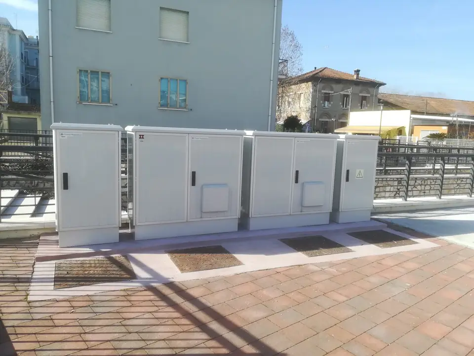 Row of cabinets on a paved surface